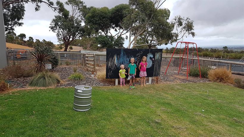 Families on the lawn outside the cellar door